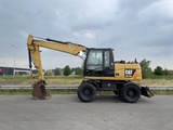 Minituur van Caterpillar M313D - CE