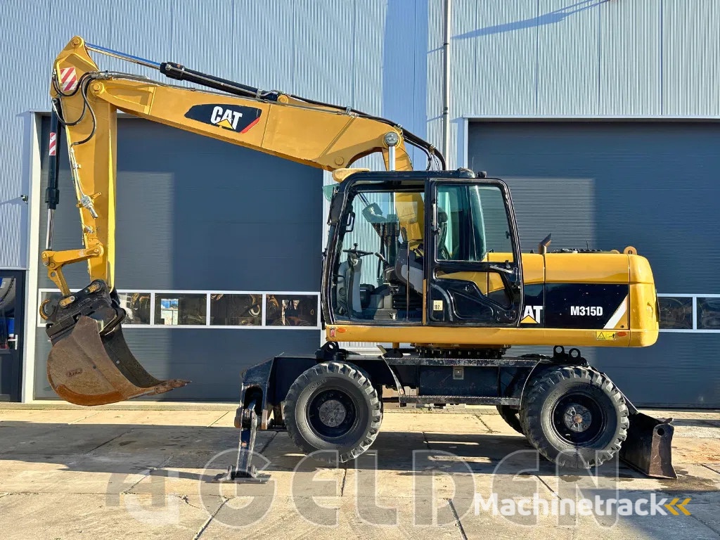 Caterpillar M315D - BLADE+OUTRIGGERS