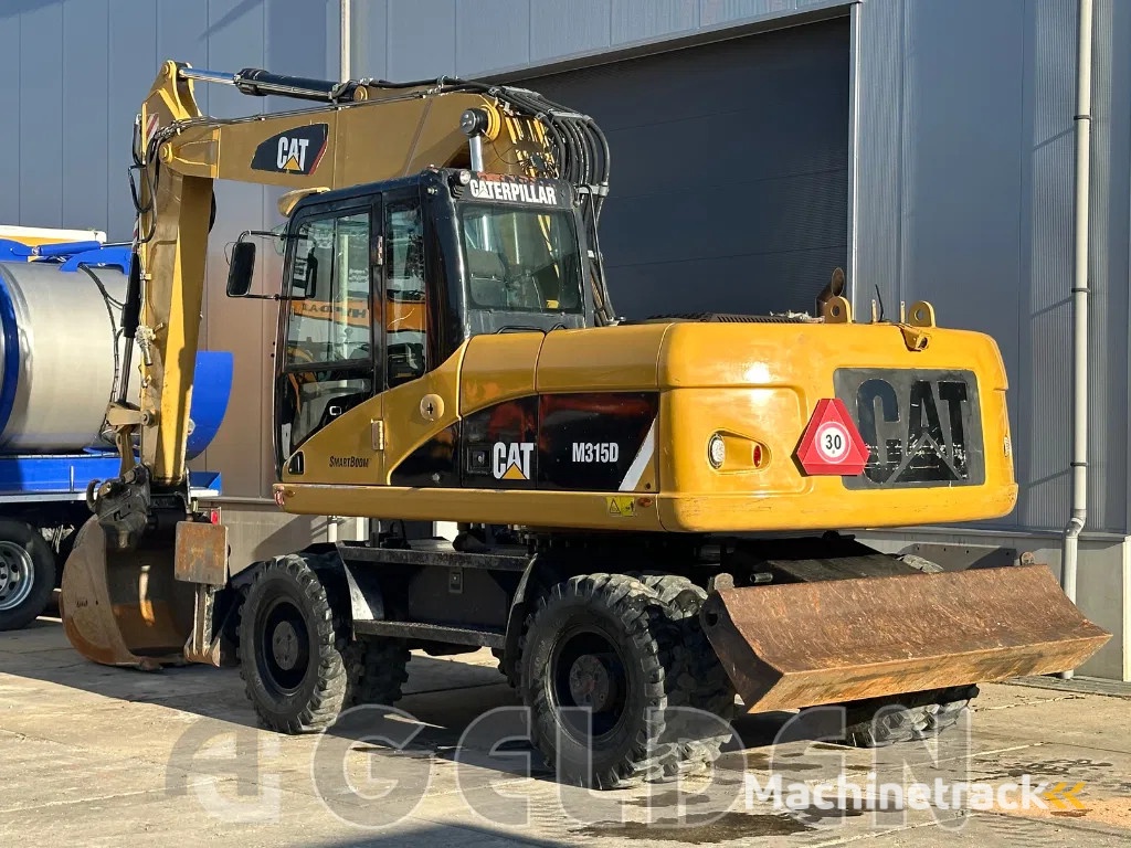 Caterpillar M315D - BLADE+OUTRIGGERS