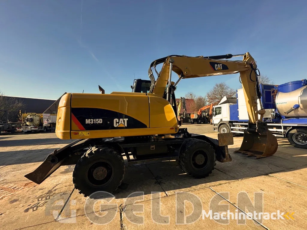 Caterpillar M315D - BLADE+OUTRIGGERS