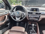 Minituur van BMW X1 sDrive18i High Executive | Automaat | Leder | Pano | Trekhaak | Cruise | PDC | All-seasons |