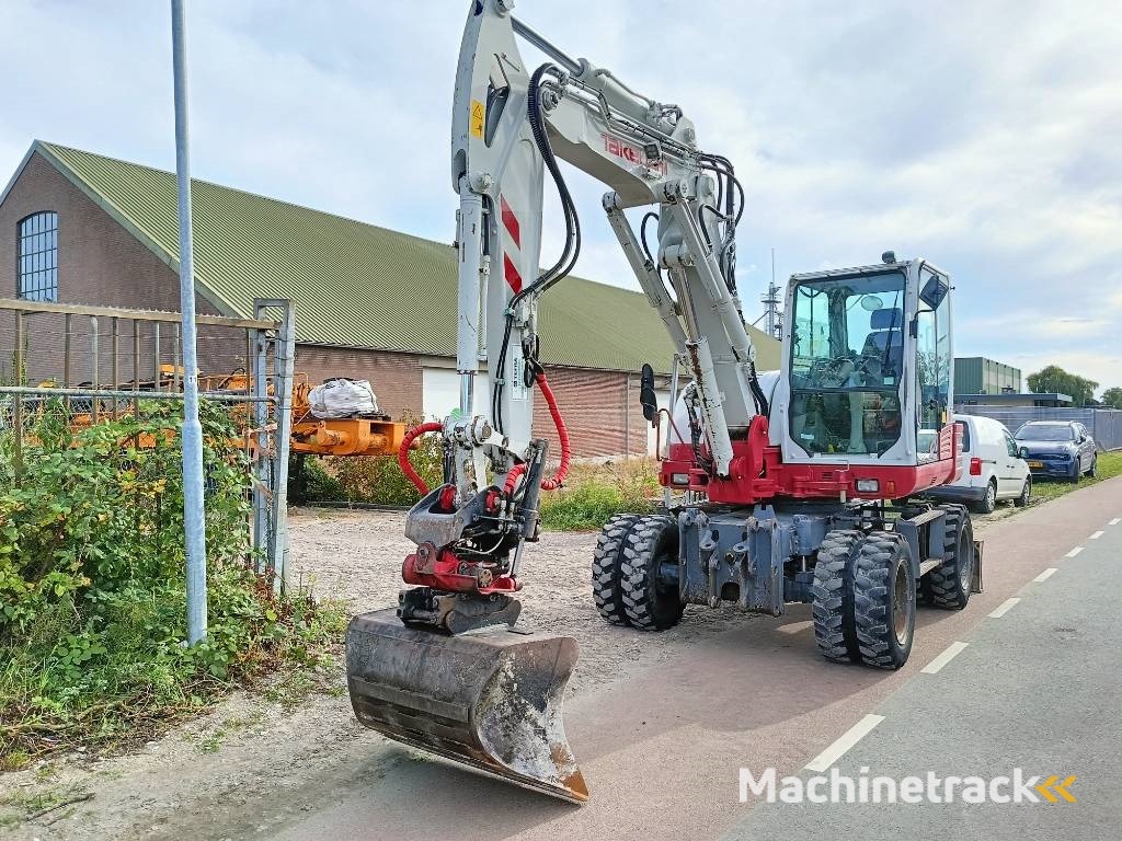 Takeuchi TB 295 W mobiele graafmachine mobile excavator