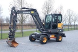 Minituur van Volvo EW60E | DEMO | 30 KM/H | ROTOTILT + GRIPPER | BUCKET