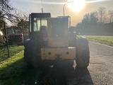 Minituur van 2000 Caterpillar TH63 verreiker
