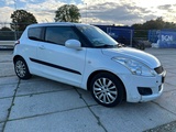 Minituur van 2011 Suzuki Swift Personenauto