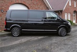 Minituur van Volkswagen Transporter T6.1 2.0 TDI 204 PK DSG CARAVELLE L2H1 A-KLEP DUB/DUB ACC | LED | Leder | Virtual Cockpit | Privacy glass |